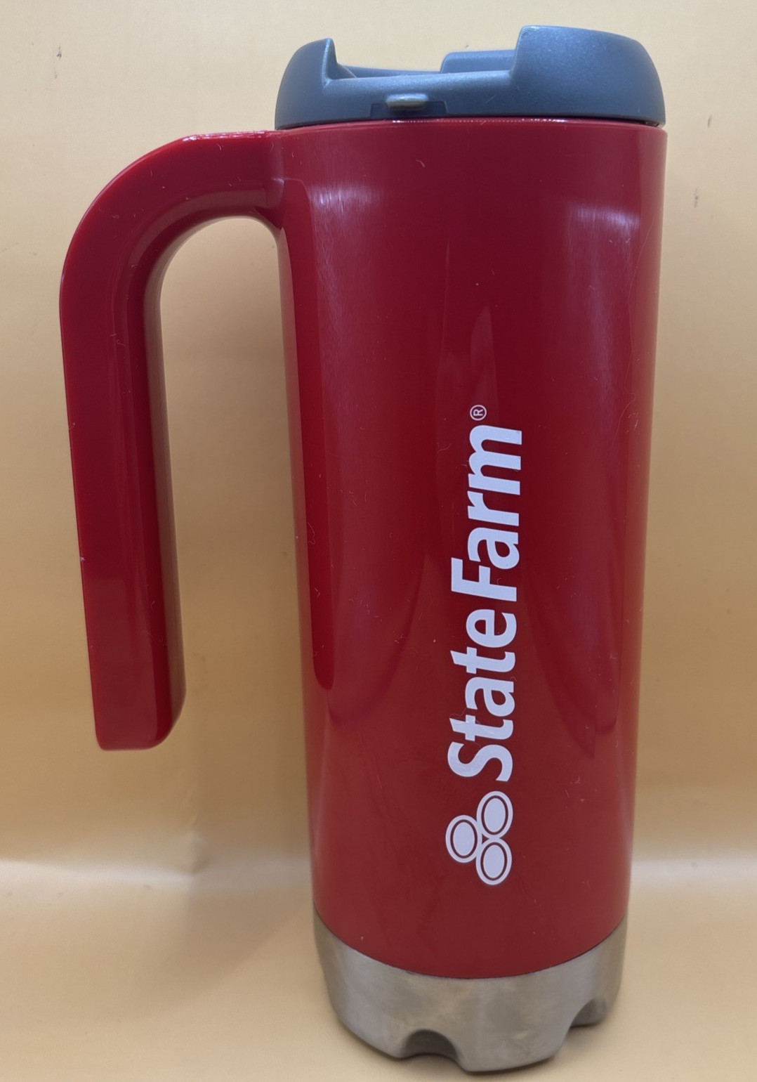 State Farm 16.9-ounce, 8.5″ tall Insulated Plastic Travel Coffee Mug w/ Handle