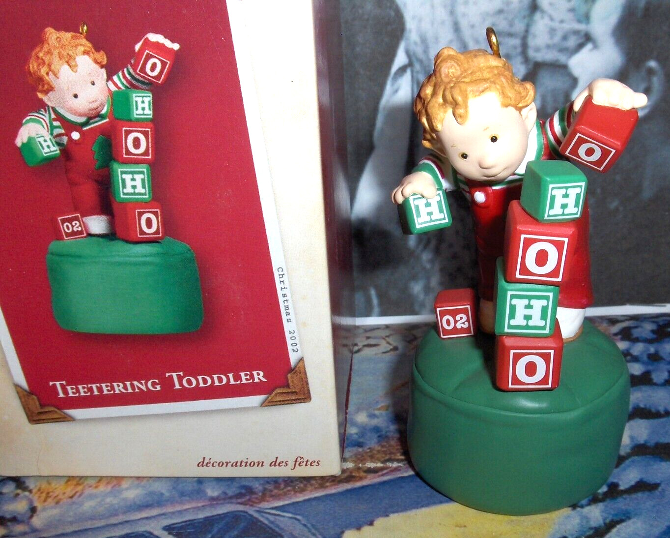 TEETERING TODDLER`2002`PUSH BUTTON ON BOTTOM-BLOCKS FALL OVER,HALLMARK ORNAMENT