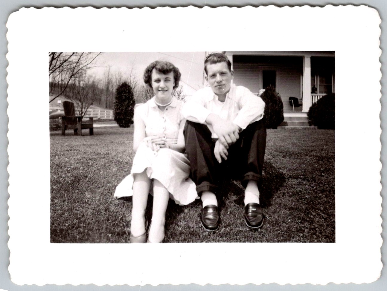 Vtg B&W Snapshot Young Couple Sitting On Lawn House Porch Loafers Fashion 1950s