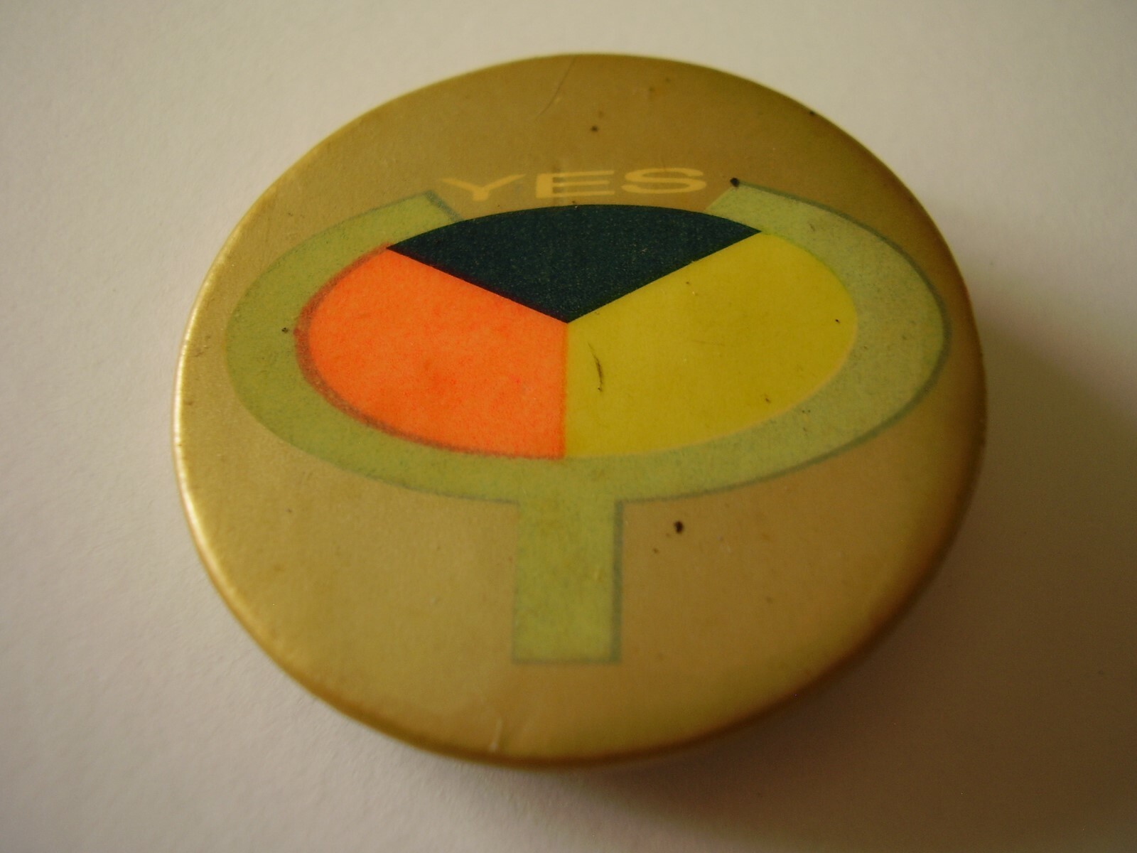 Vintage Pinback YES with Black Orange Yellow Three-Part Symbol