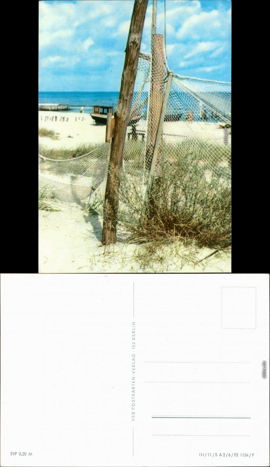 General Mecklenburg Vorpommern fishing boat on the beach with fishing net 1973