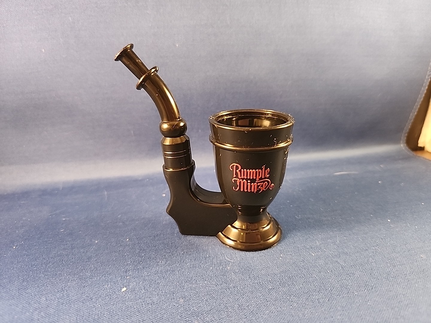 Vintage RUMPLE MINZE SCHNAPPS SHOT GLASS (Tobacco Pipe Shape) Black Plastic VTG