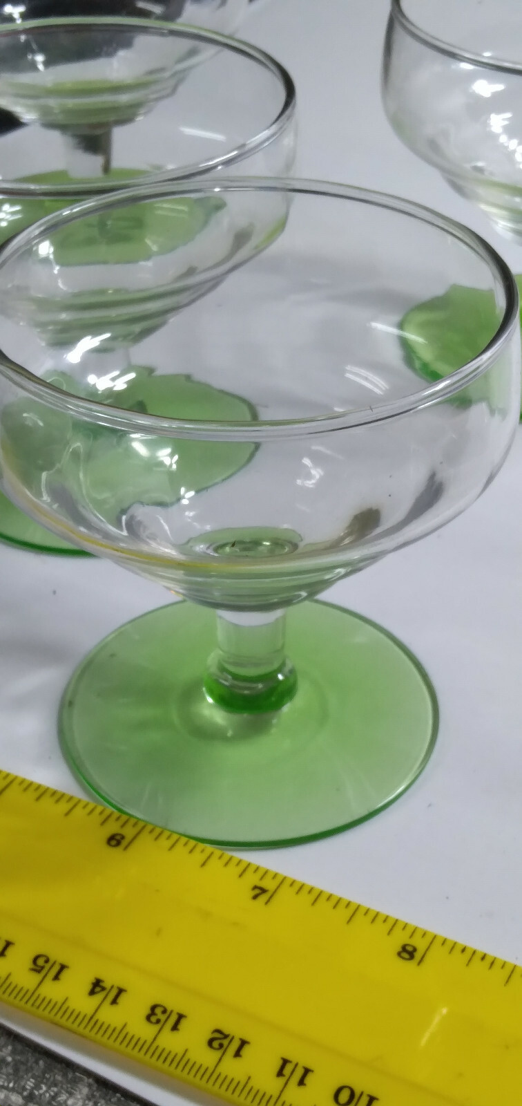 5 green base low stem glassware about 3 7 1/2 inches high by 3 inches wide