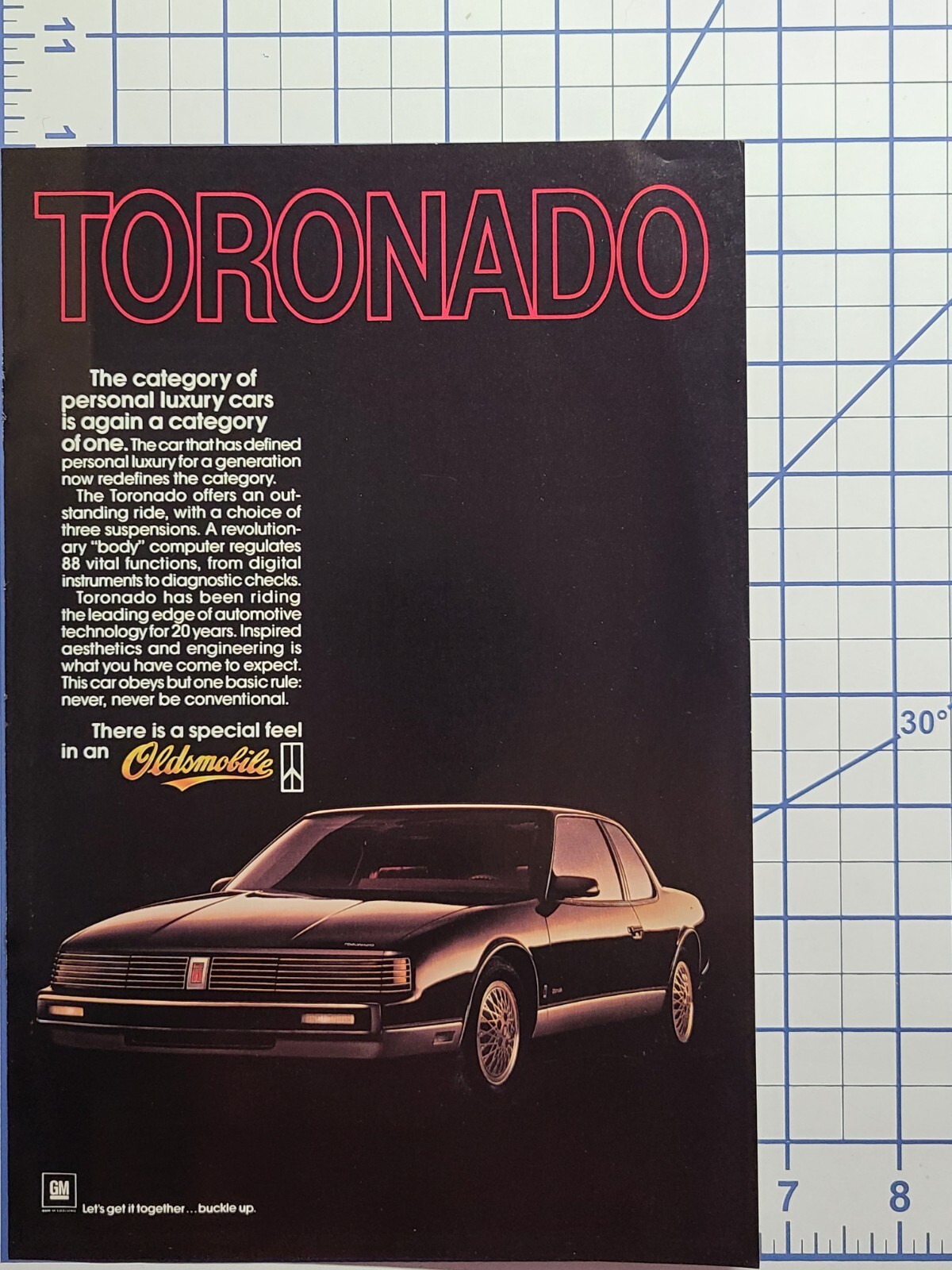 Vintage Print Ad 1986 Oldsmobile Toronado Black 2-Door Luxury Car