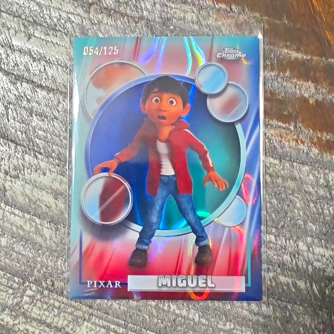 Topps 2026 Topps Chrome Disney Pixar Miguel #122 Serial Numbered 054/125