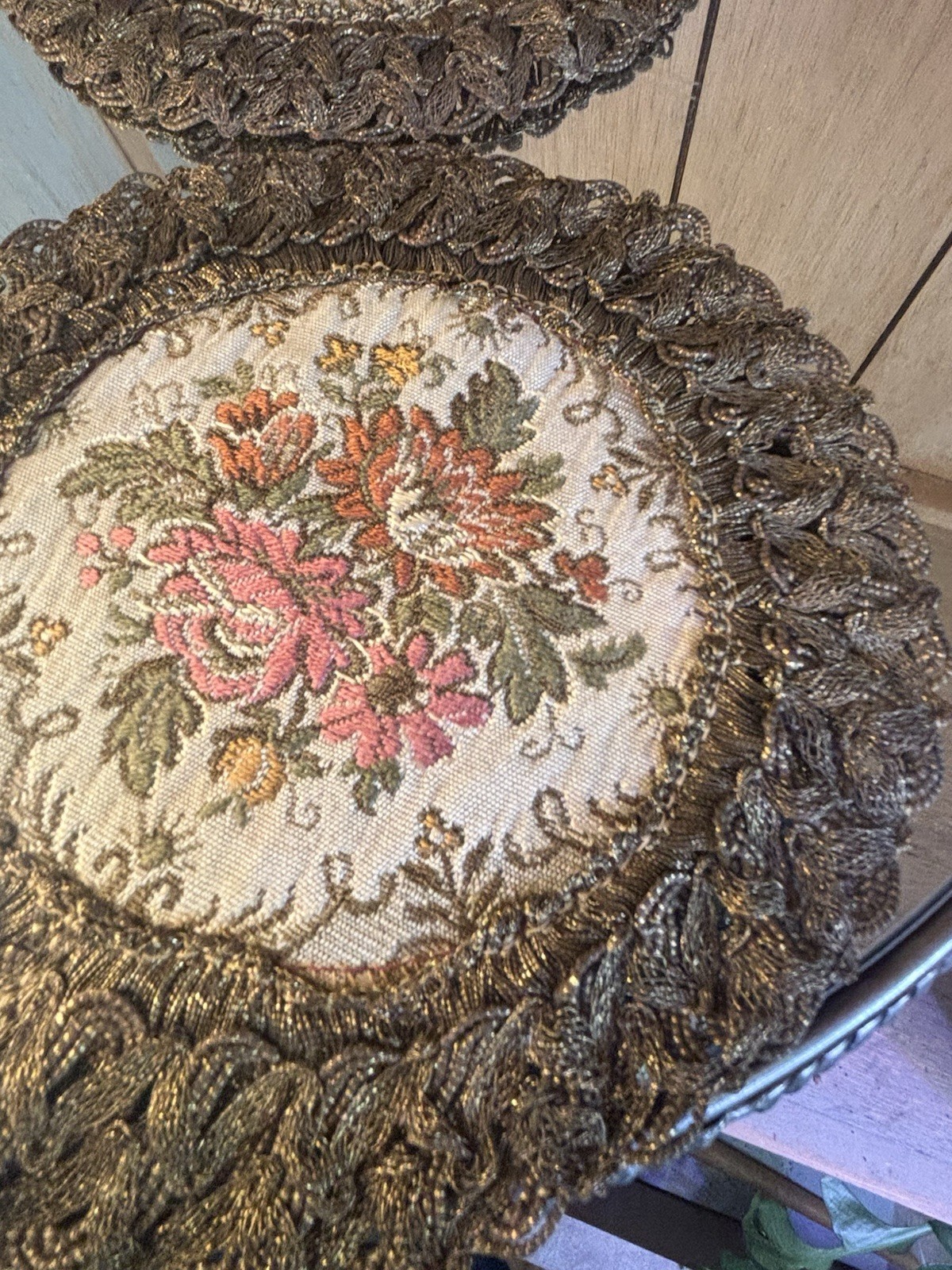 2- GOLD METALLIC THREAD EMBROIDERED TABLE DOILIE. RED LINING. FLORAL DECORATION