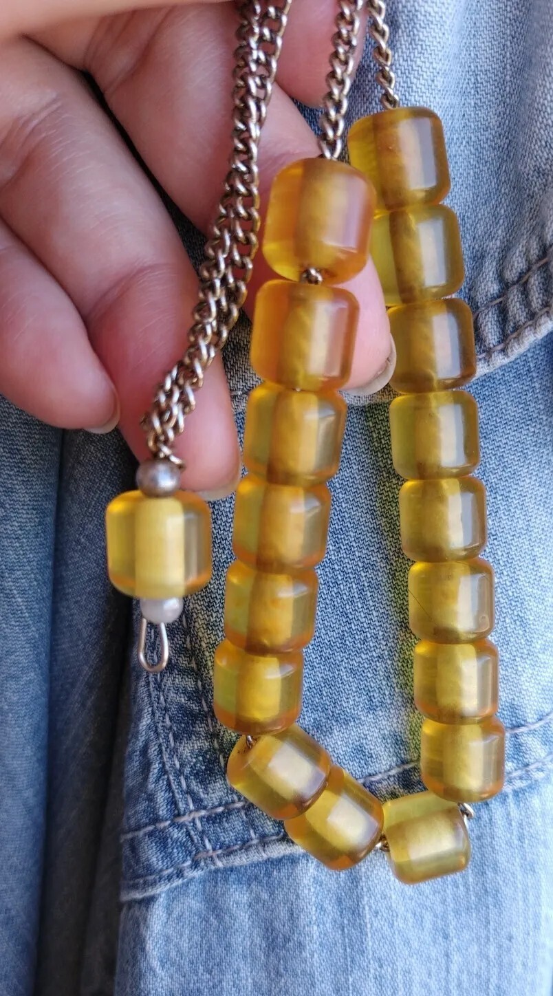 Plastic and metal prayer beads, yellow