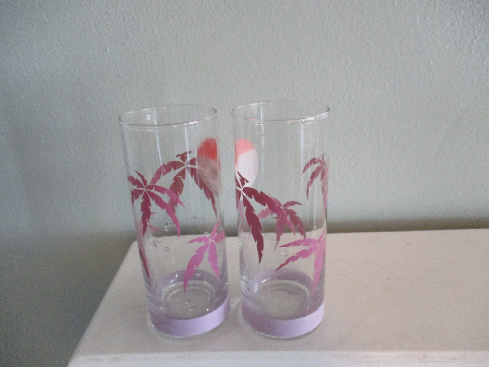 pair of Tom Collins Highball Drinking Glasses pink palm trees hazy sun