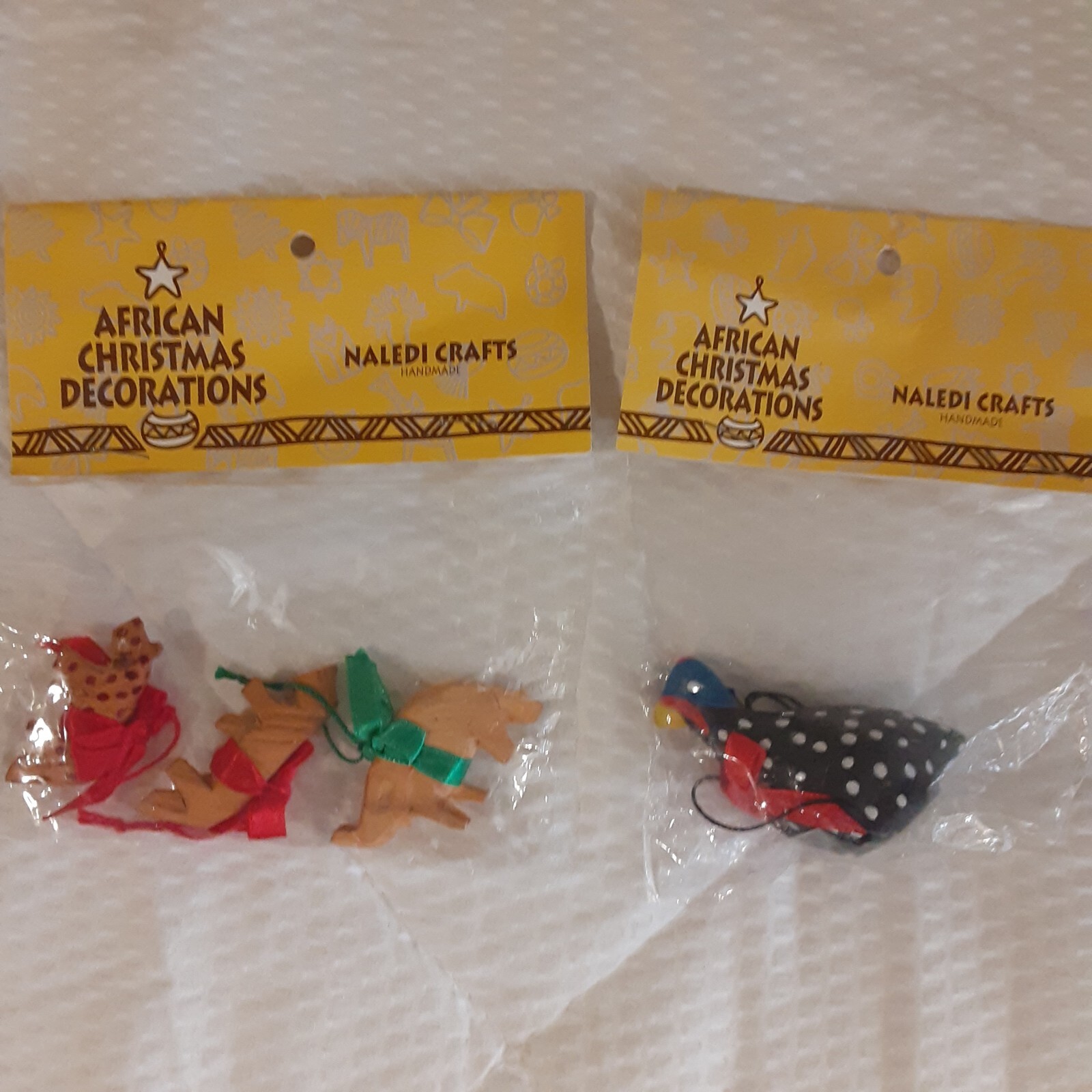 Handcrafted African minature wood crafting decor/ornament. 4 pieces.