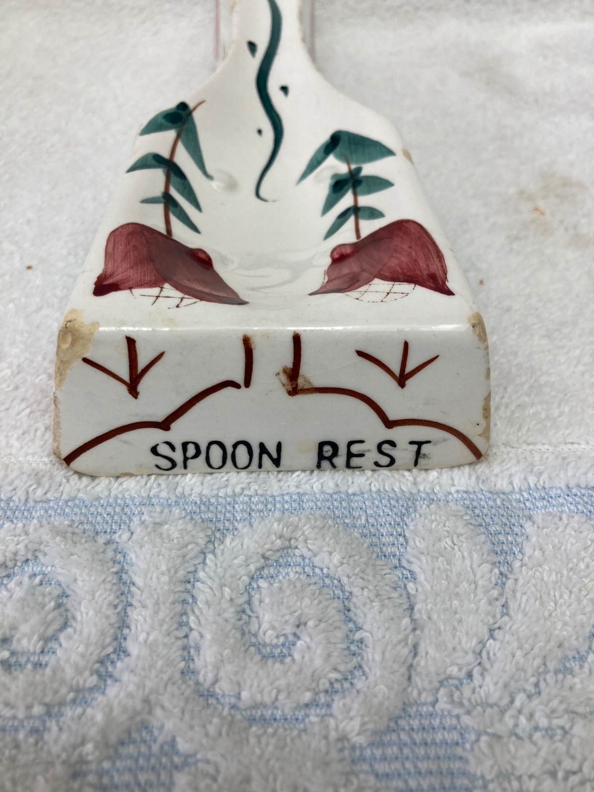 vintage ceramic spoon rest featuring a hand-painted floral design