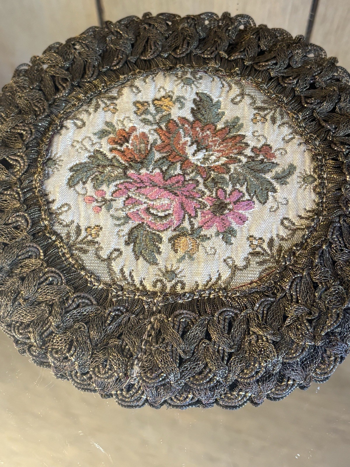 2- GOLD METALLIC THREAD EMBROIDERED TABLE DOILIE. RED LINING. FLORAL DECORATION