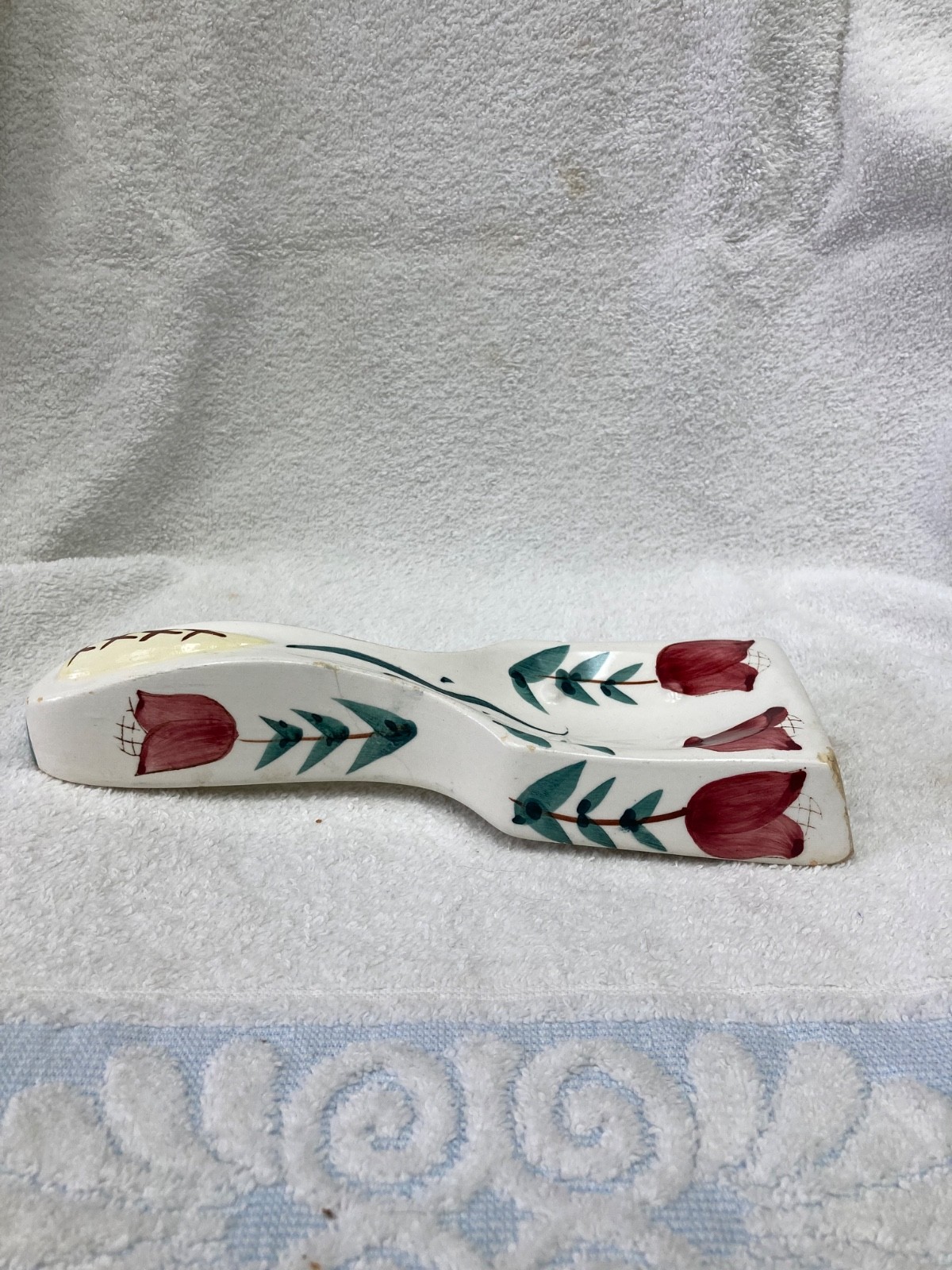vintage ceramic spoon rest featuring a hand-painted floral design
