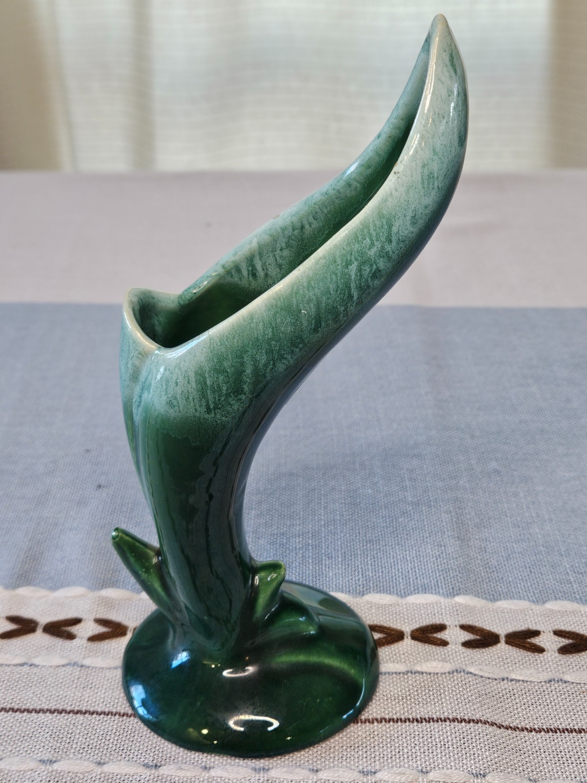 Vintage green ceramic vase with leaf design. 8″ tall. Round base is 3.25″