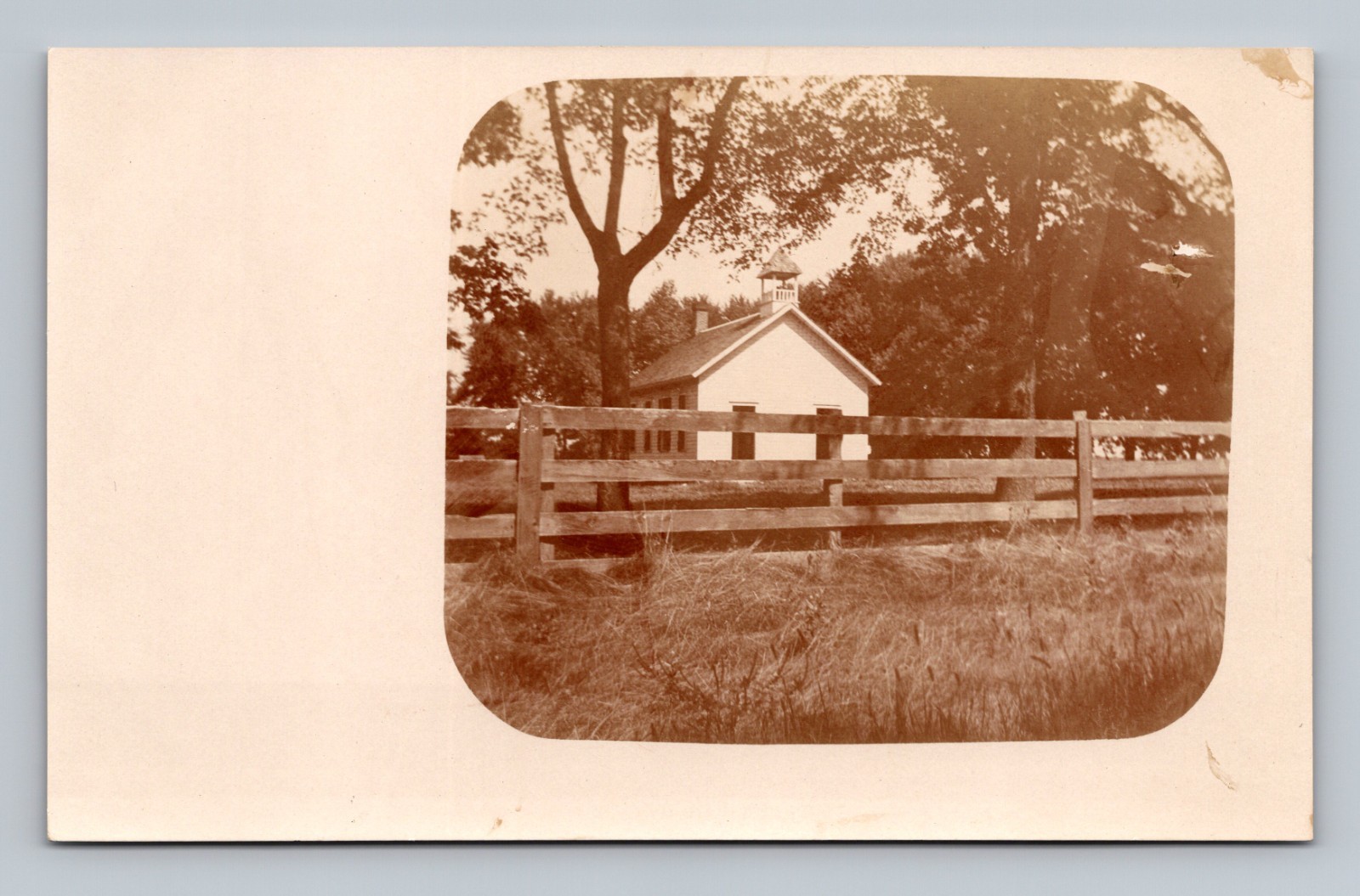 One Room Schoolhouse School Building Wooden Fence Prairie 1910 RPPC Postcard