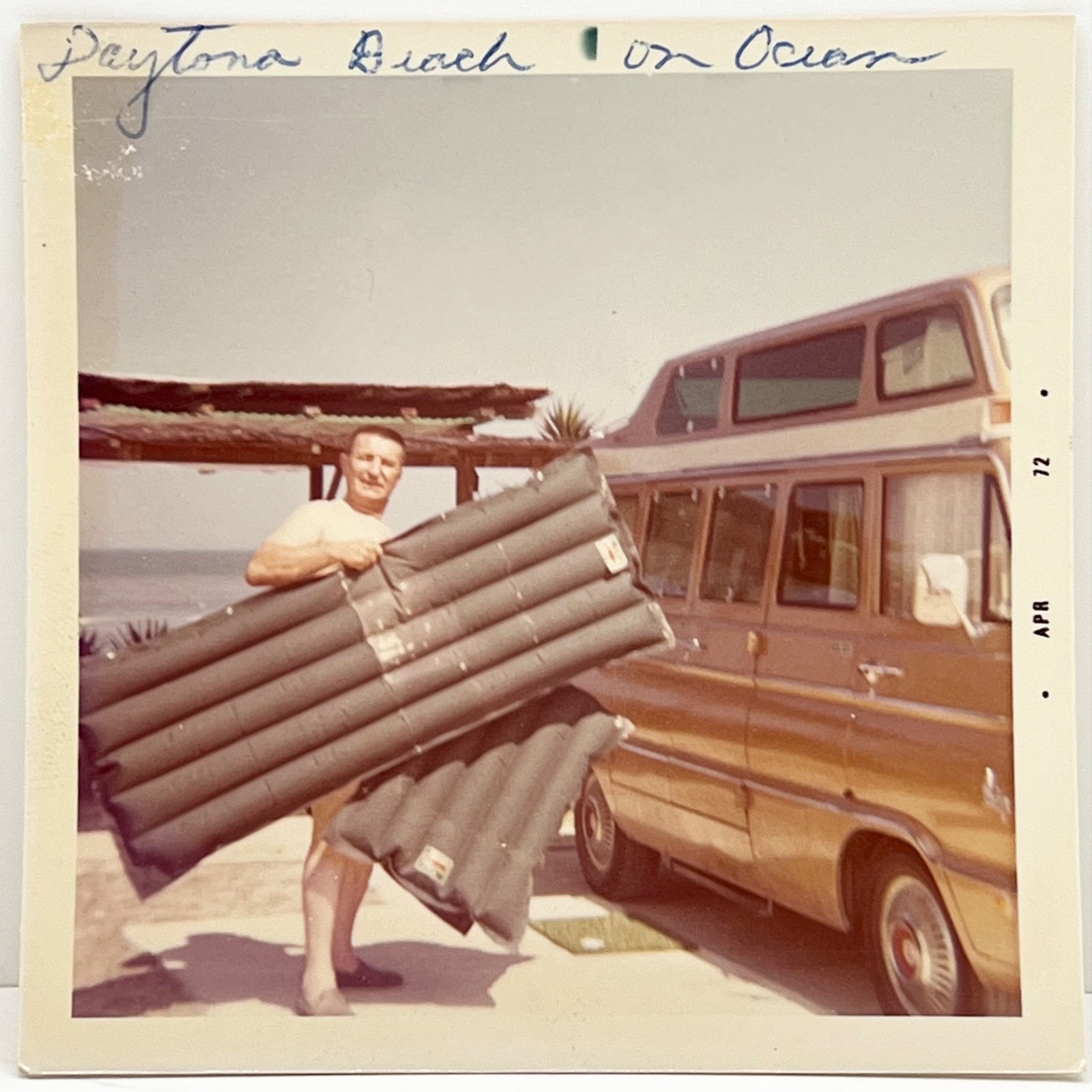 1970s Man Carrying Inflatable Raft Daytona Beach Florida Vintage Snapshot Photo
