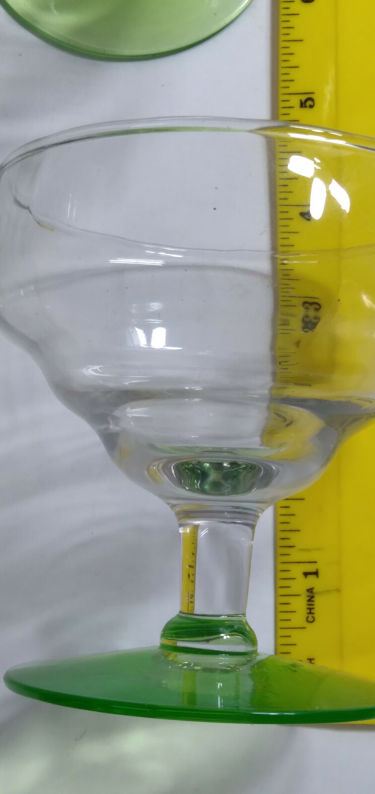 5 green base low stem glassware about 3 7 1/2 inches high by 3 inches wide