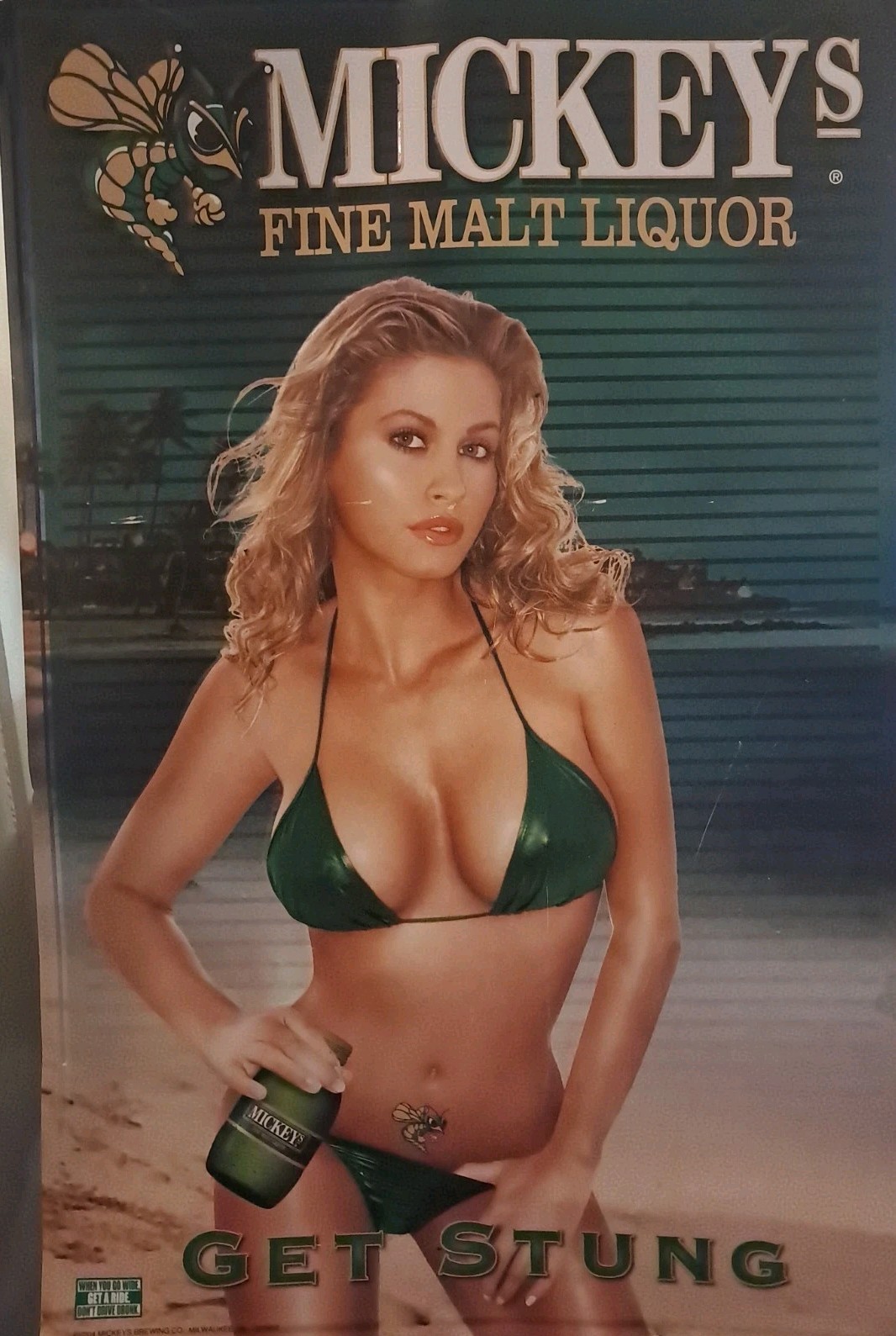 Mickeys Brewing Co 30X20″ Metal Advertising Poster GET STUNG Blonde Green Bikini