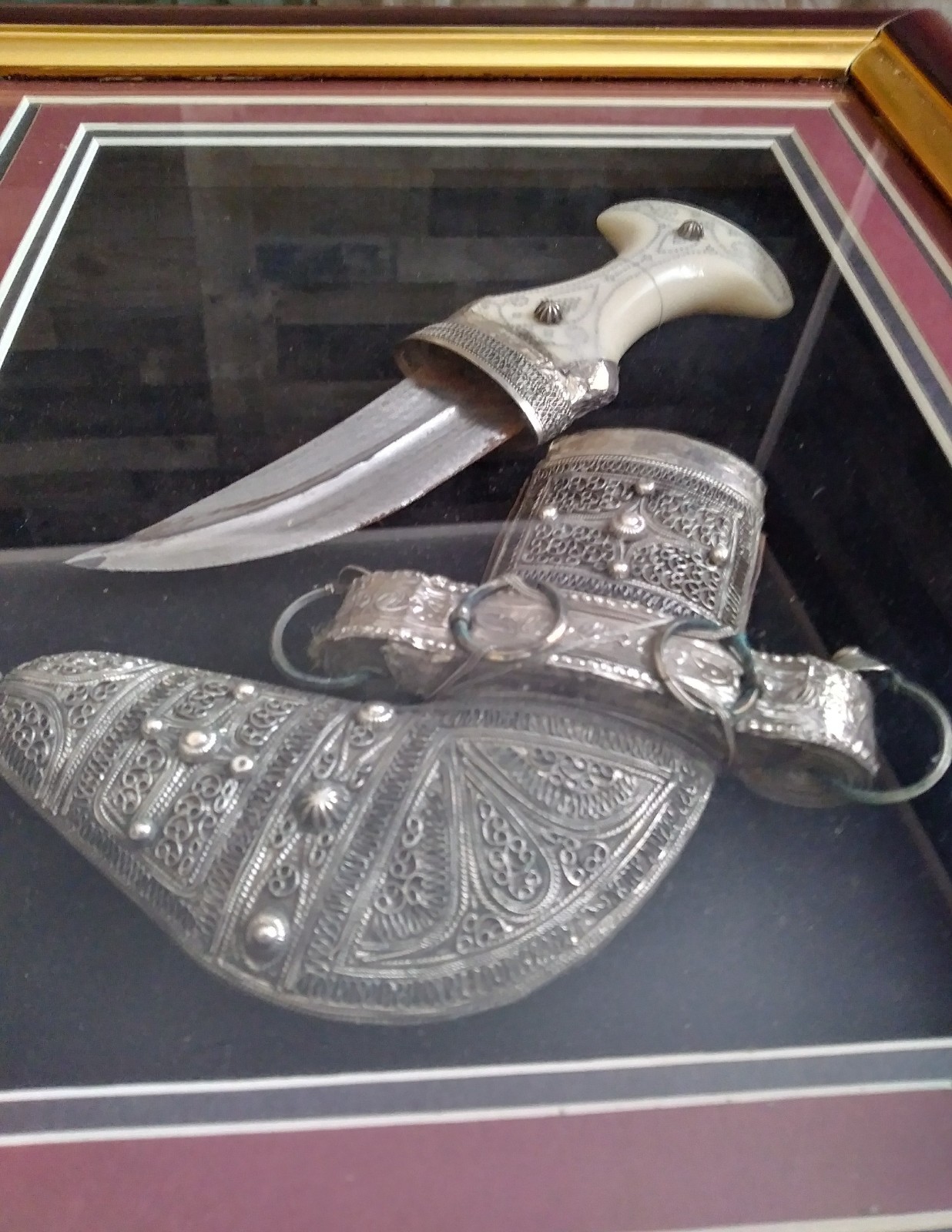 Ceremonial decrotive dagger & sheath in frame from Oman