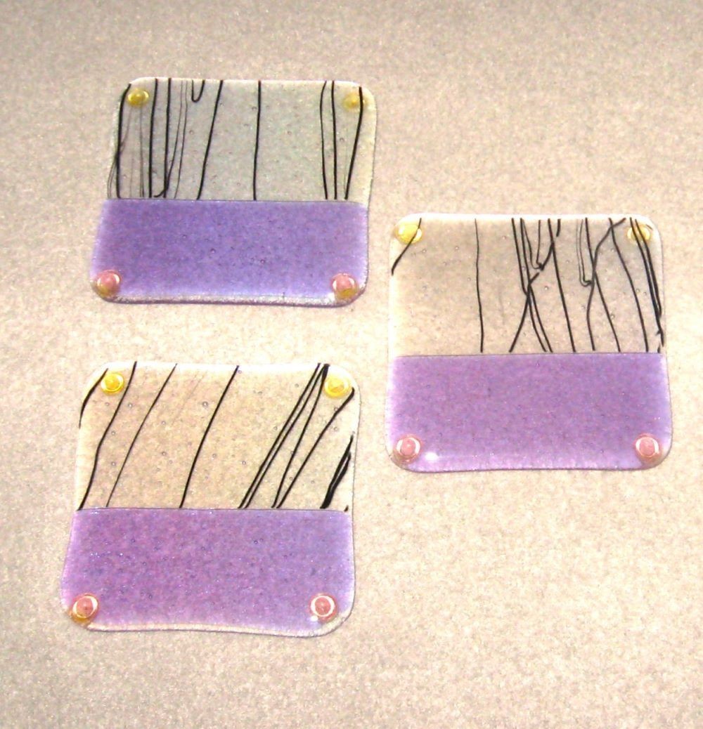 THREE FUSED ART GLASS IRIDESCENT LAVENDER BLACK CLEAR SQUARE FOOTED COASTERS