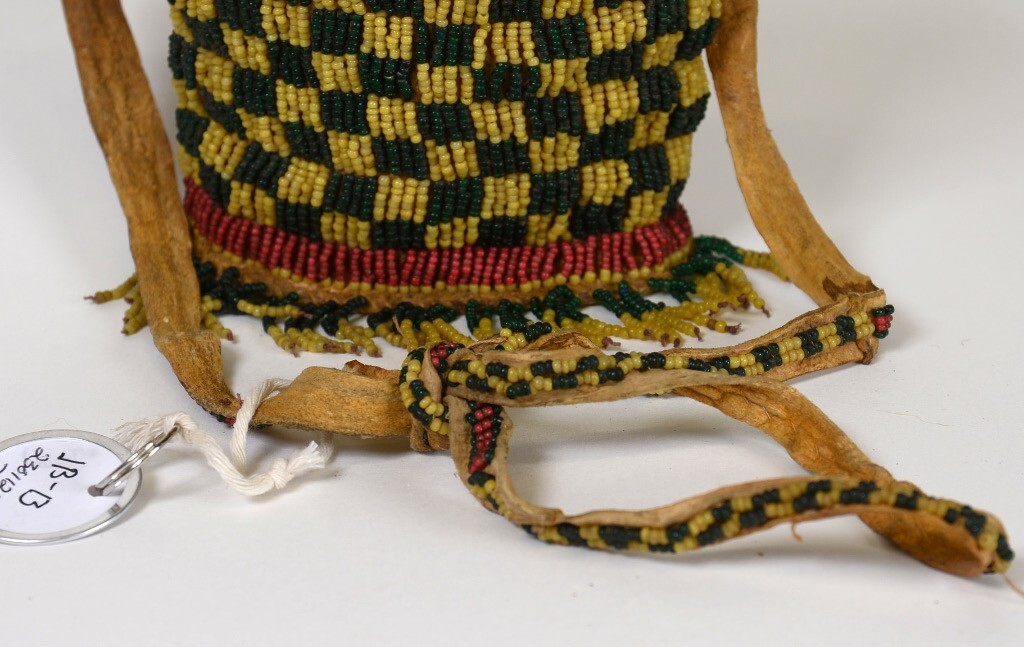 Apache Beaded Bag with Strap, Flap, Button Closure, and Oval Rawhide Base