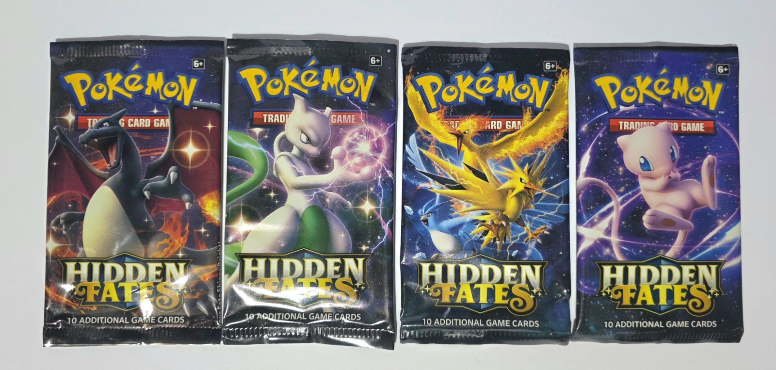 Pokémon Hidden Fates EMPTY PACKS – LOT OF 4 – 1x Each Art – NO CARDS