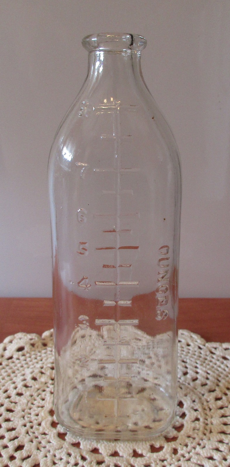 Vintage 8 Ounce Clear Glass Baby Bottle Embossed Ounces 7″