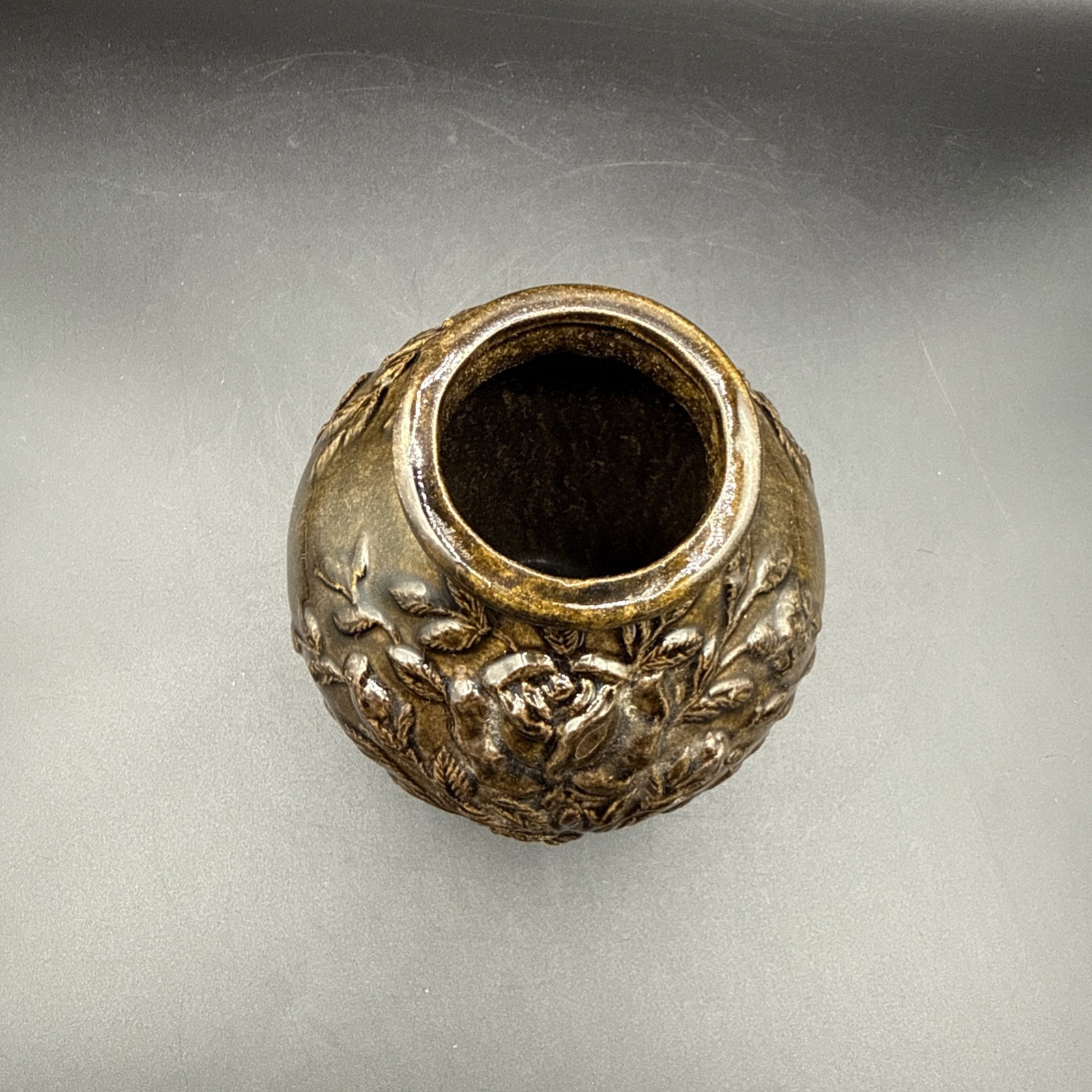 Ceramic vase with bronze-tone glaze& floral relief decoration by R.R.P. Co.