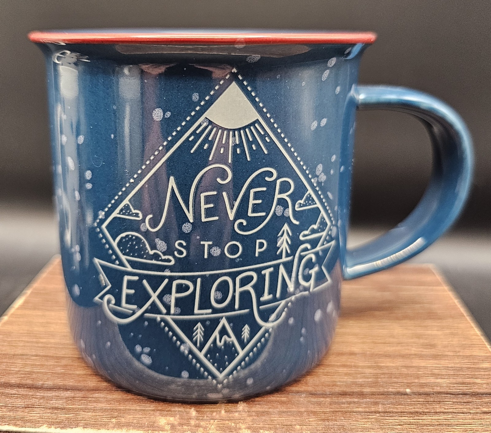 Never Stop Exploring Blue Speckled Stoneware Coffee Mug Red Rim