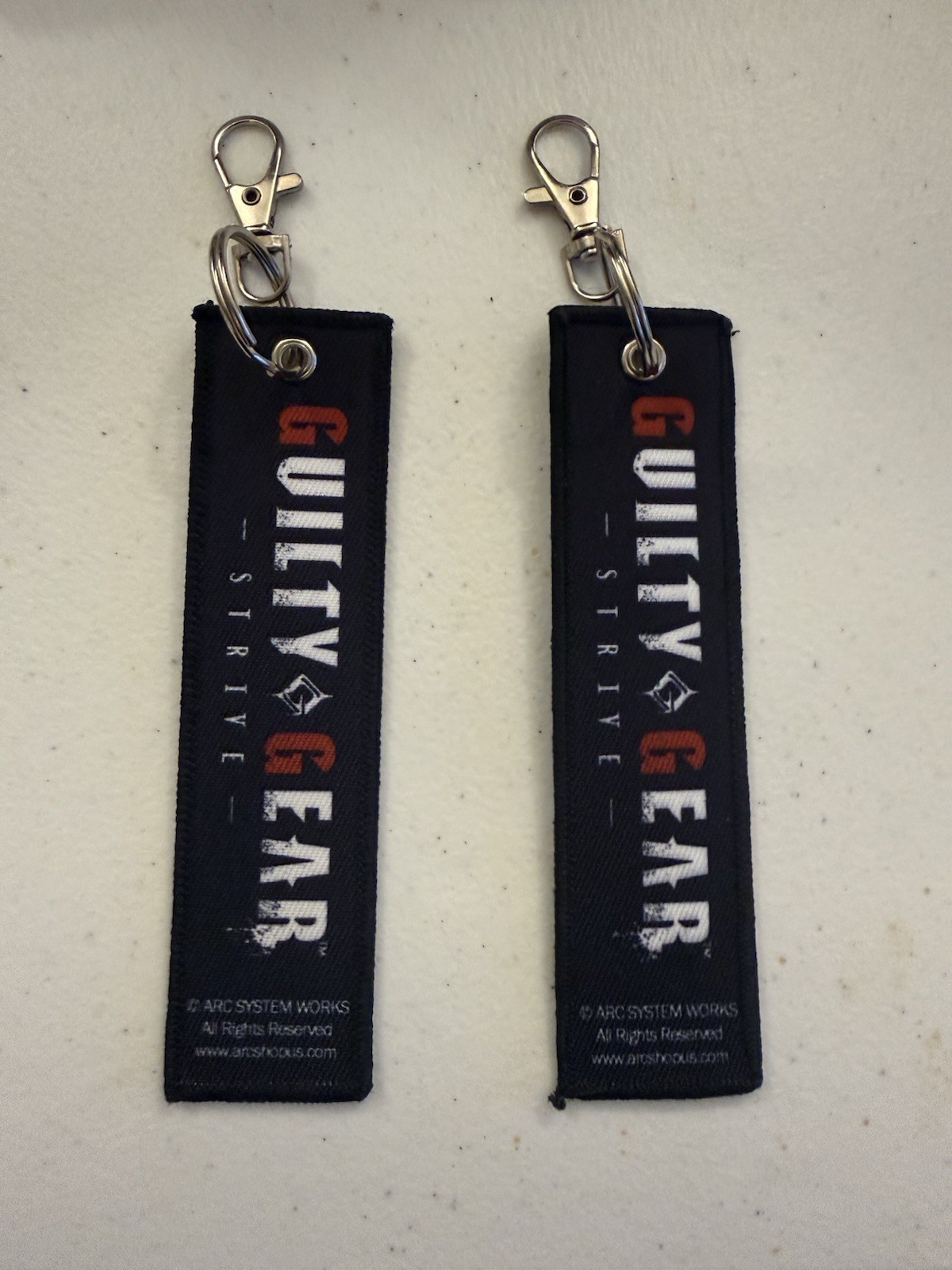 Guilty Gear Strive Collectible Ramlethal Valentine And JackO Flight Tag Keychain
